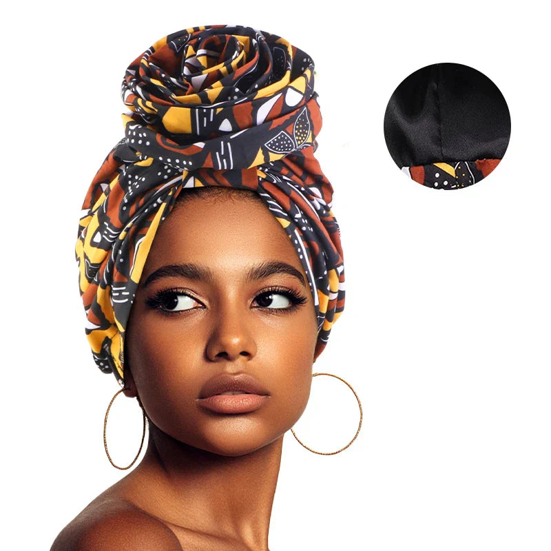 Black and yellow Afrocentric Melody Headwrap with satin lining, featuring a bold African print. Pre-tied design ensures easy styling and a secure fit.