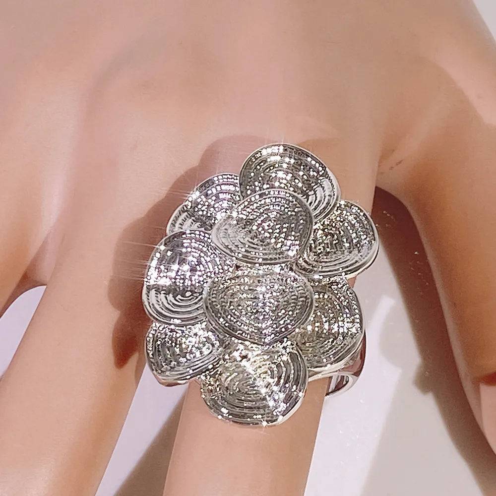 Elegant silver floral ring with intricate texture, perfect for weddings. A luxury unisex accessory in the jewelry ring category.