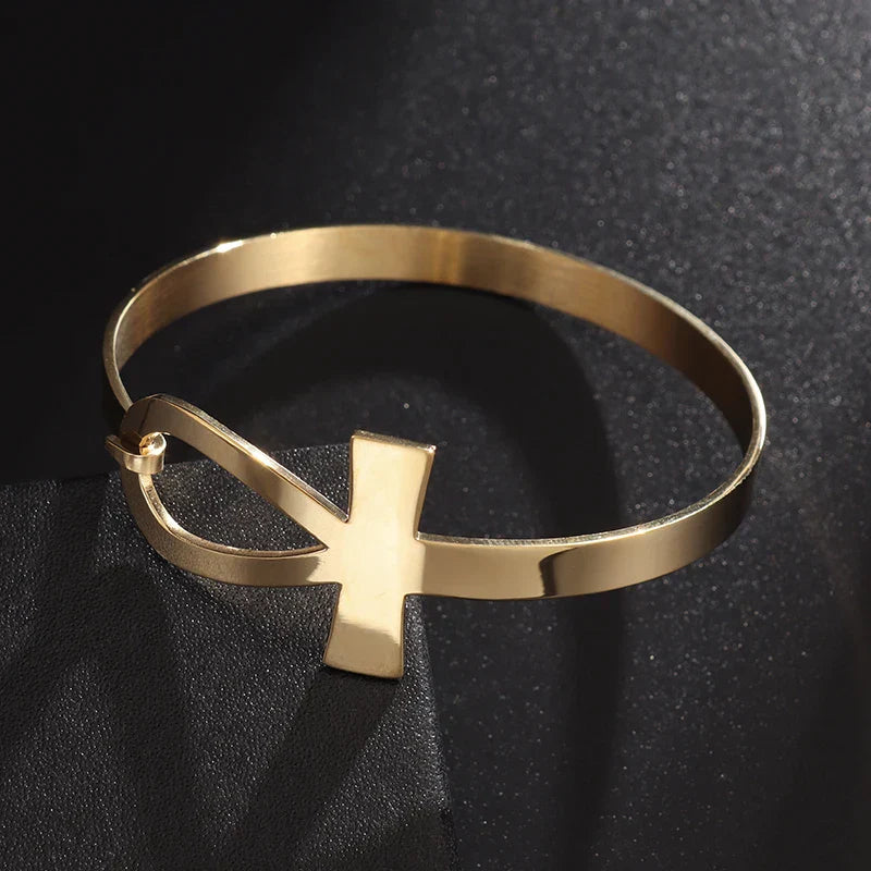 Gold-tone Faithful Embrace Hair Cuff and Bracelet with an Ankh symbol. A unique, non-damaging accessory for locs or as a chic wrist bracelet.
