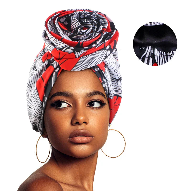 Red, black, and white Afrocentric Melody Headwrap with satin lining. A fashionable and functional hair accessory for women seeking effortless elegance.