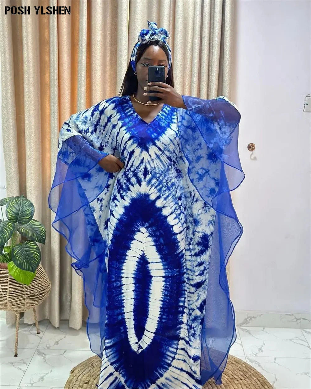 Blue and white mesh patchwork caftan abaya dress with headscarf, showcasing a bold African print and elegant sheer fabric.