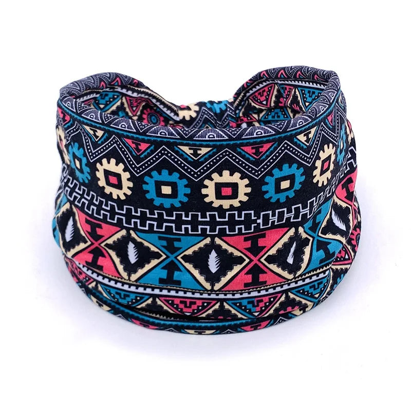 Bohemian-style yoga headband with intricate tribal patterns, designed for braids, locs, sisterlocks, and dreadlocks. Soft and stretchy material.