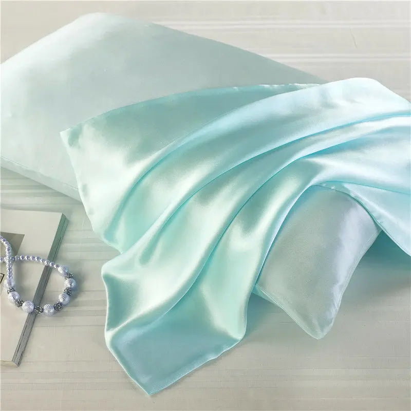 Pastel mint green natural mulberry silk pillowcase for locs. Smooth, breathable, and hypoallergenic for a luxurious and protective sleep experience.
