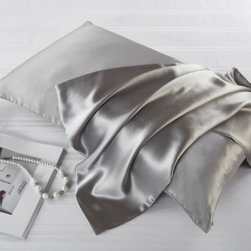 Elegant gray natural mulberry silk pillowcase for locs. Smooth, breathable, and hypoallergenic for a luxurious and protective sleep experience.