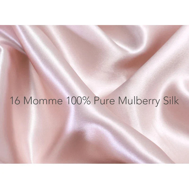 Close-up of 16 momme 100% pure Mulberry silk fabric in pink. Premium silk texture used in frizz-free sleep bonnets for long hair.