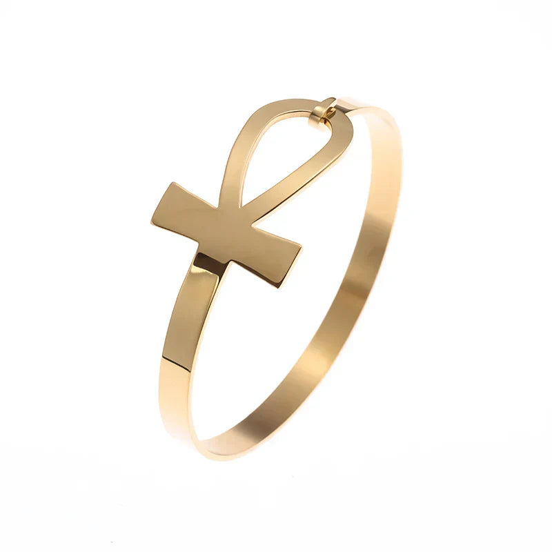 Minimalist gold Faithful Embrace Hair Cuff and Bracelet with an Ankh symbol. A stylish and meaningful accessory for hair or wrist adornment.