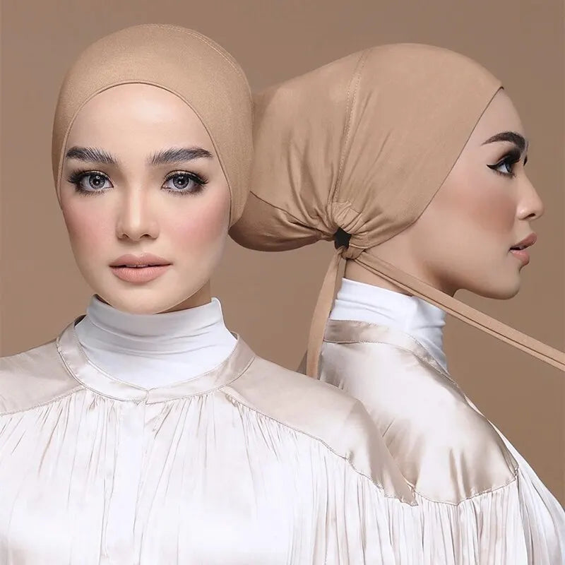 Elegant beige adjustable headwrap worn by a model, showcasing its snug fit and stylish design for versatile wear.