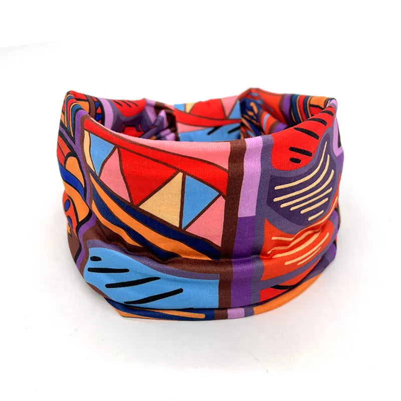 Bold and colorful yoga headband with abstract patterns, perfect for braids, locs, sisterlocks, and dreadlocks. Comfortable and stylish fit.