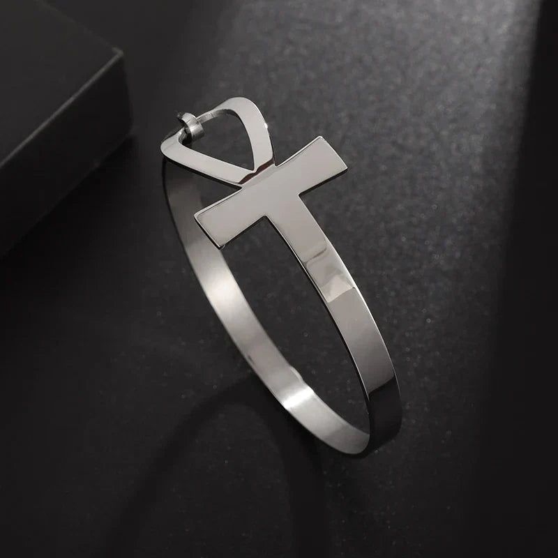 Sleek silver Faithful Embrace Hair Cuff and Bracelet with an Ankh charm. A modern and symbolic piece for both hair styling and wrist wear.