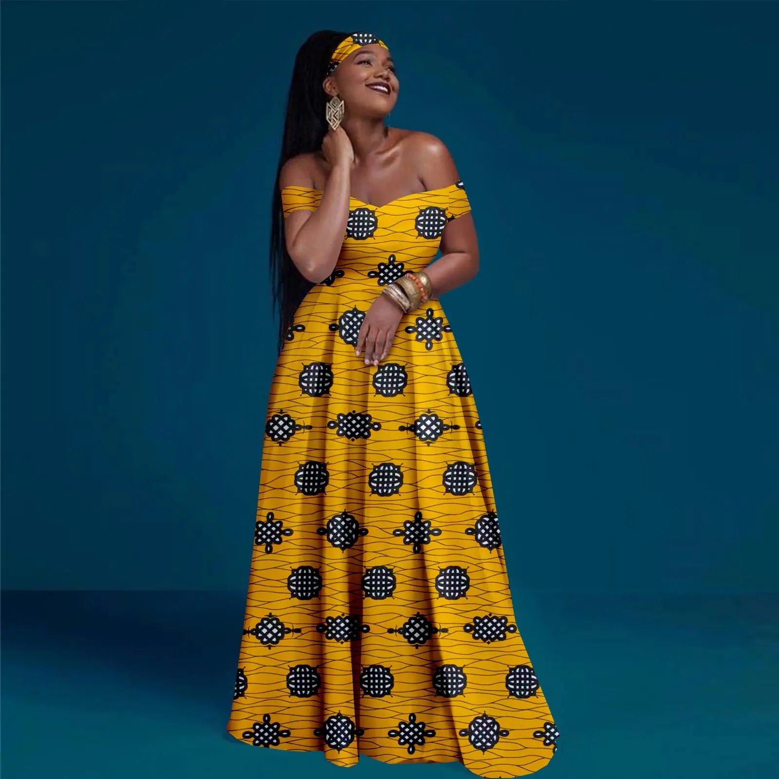 Woman wearing a yellow patterned dress against a blue background