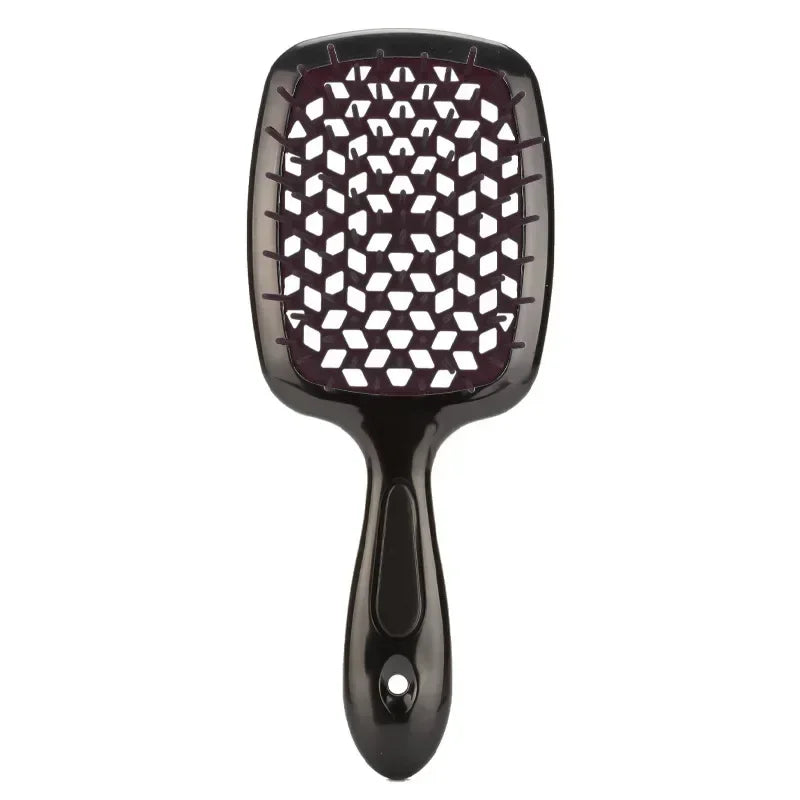 Bright orange detangling brush with neon green bristles, ideal for curly and 4C hair. Provides a comfortable grip and smooth detangling experience.