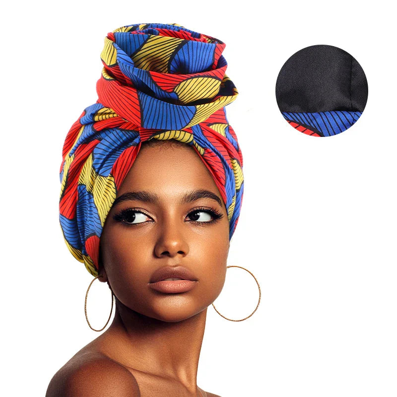 Red, blue, and yellow Afrocentric Melody Headwrap with satin lining. A vibrant and stylish headwear option for women who love bold prints.