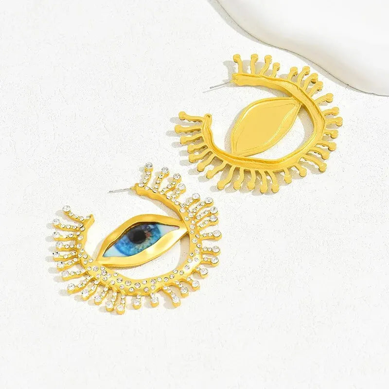 Back and front view of Visionary Gaze Earrings, displaying the intricate gold-tone eye design with crystal embellishments. Stylish earrings for women.