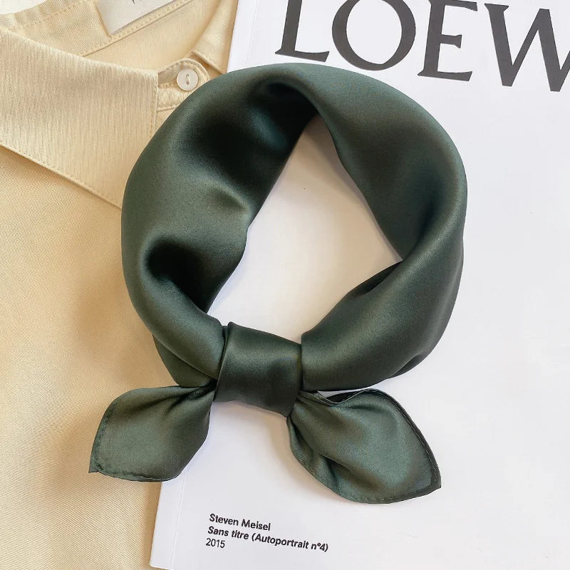 Silk Bandana Scarf - Ivory Elegant in deep olive green, tied in a bow on a magazine and beige shirt. Pure silk accessory for timeless style.