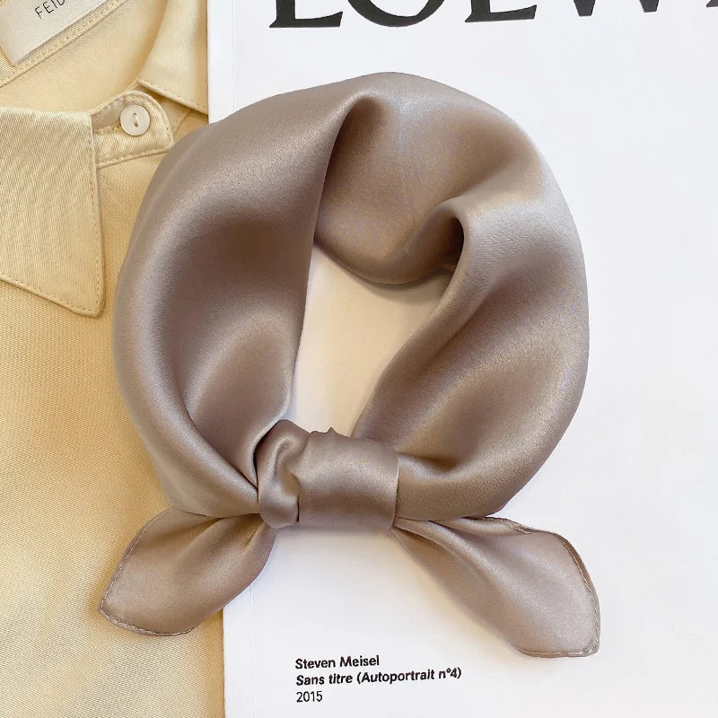 Silk Bandana Scarf - Ivory Elegant tied in a bow on a neutral background. Pure 100% silk with a soft sheen, ideal for timeless wardrobe styling.