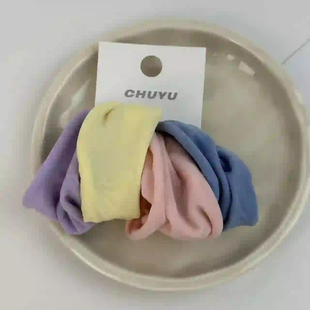 Pastel-colored non-damaging hairbands for locs and braids. Soft, chemical-free bands perfect for gentle styling.