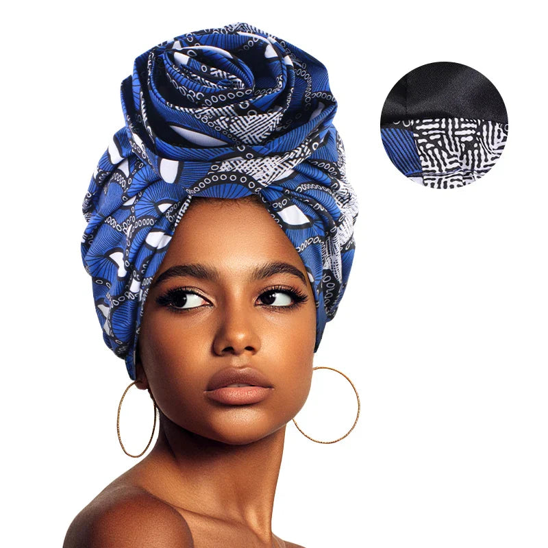 Blue and white Afrocentric Melody Headwrap with satin lining, featuring an intricate African print. Pre-tied design ensures effortless styling and comfort.