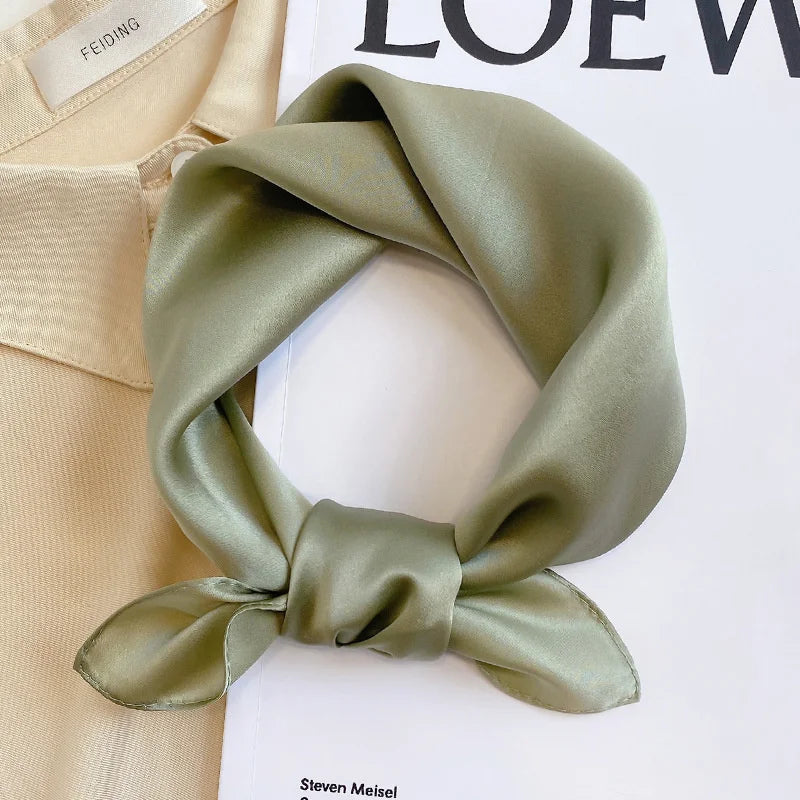 Silk Bandana Scarf - Ivory Elegant in soft sage green, made from 100% pure silk with a smooth, glossy finish. Perfect for elevating any outfit.