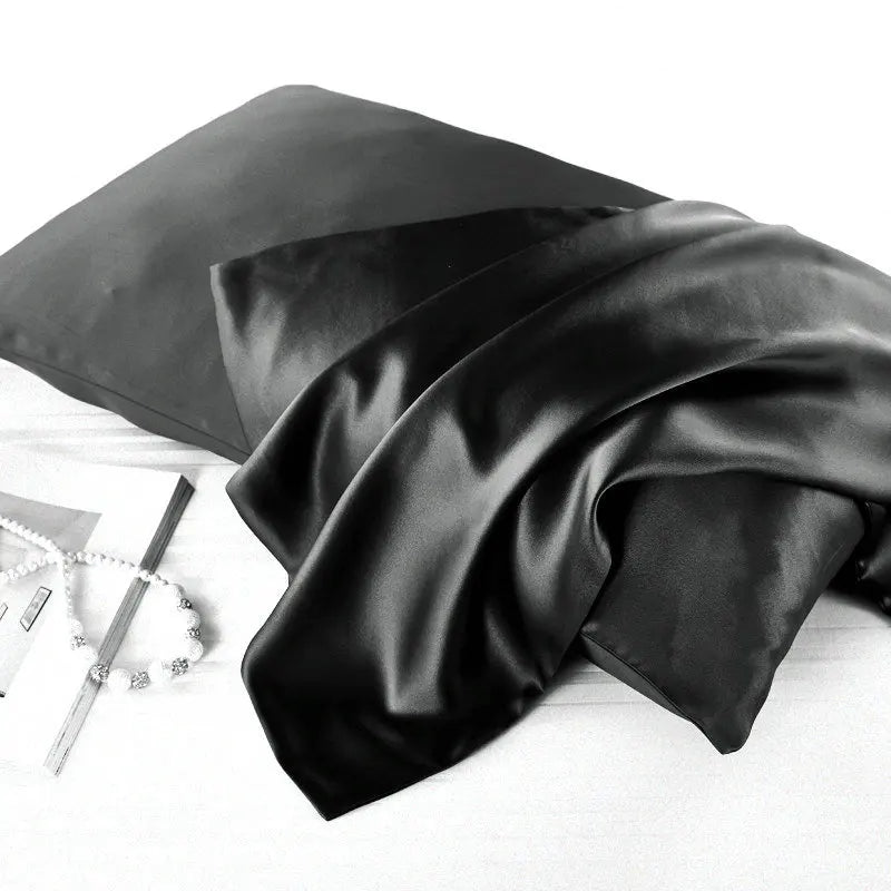 Classic black natural mulberry silk pillowcase for locs. Smooth, breathable, and hypoallergenic for a luxurious and protective sleep experience.