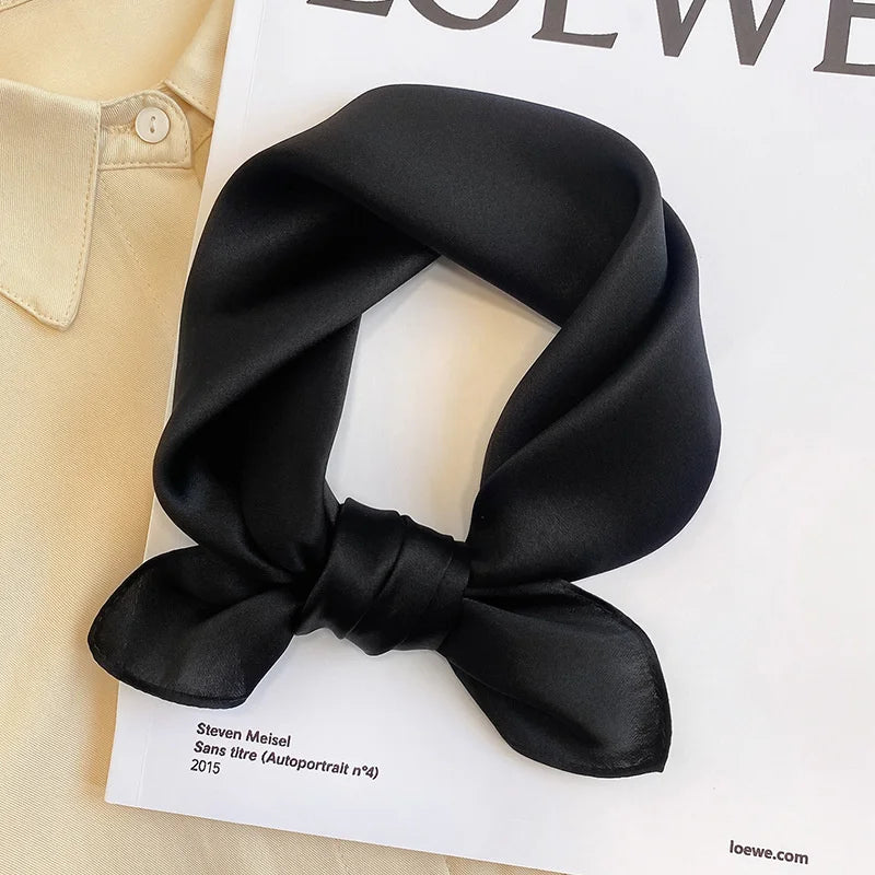 Silk Bandana Scarf - Ivory Elegant in black, crafted from 100% pure silk with a smooth, glossy finish. Perfect for elevating any outfit with timeless style.