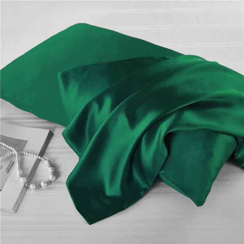 Emerald green natural mulberry silk pillowcase for locs. Smooth, breathable, and hypoallergenic for a luxurious and protective sleep experience.