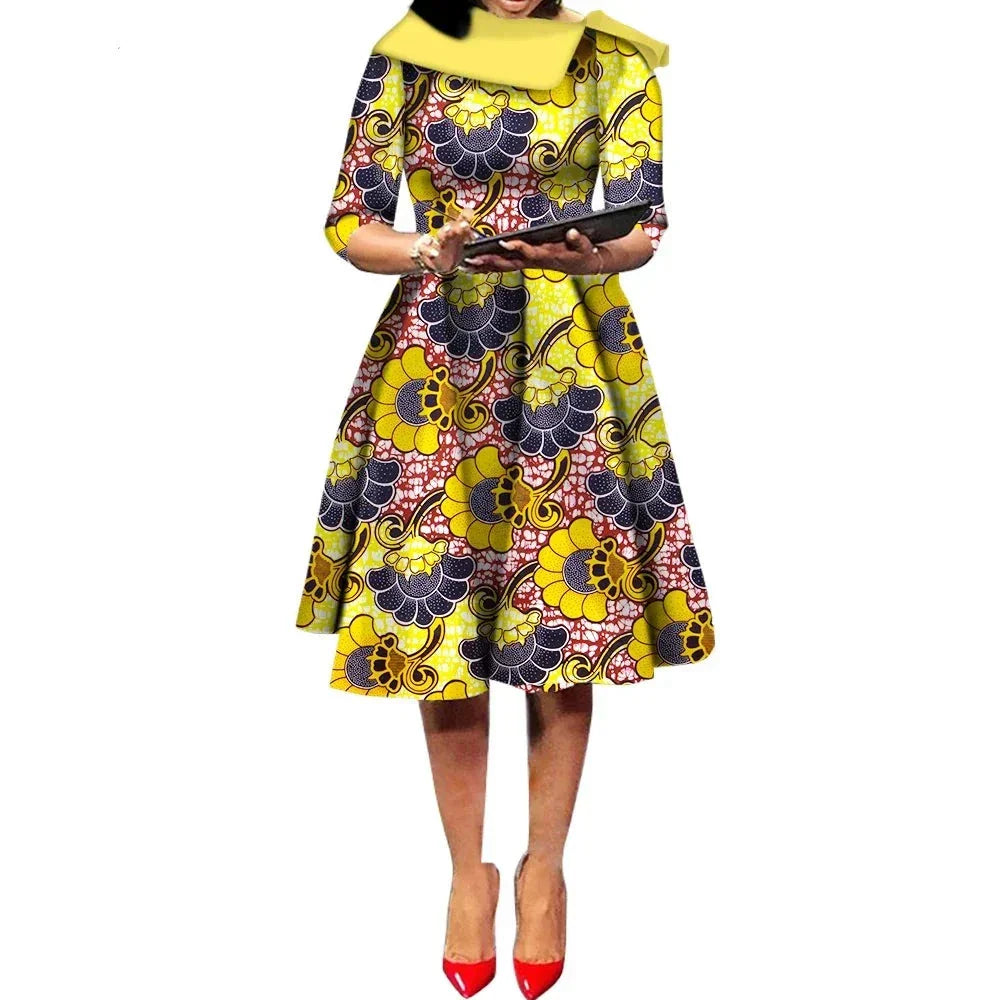 African Ankara Wax Print Midi Dress in yellow with intricate blue and red floral patterns, featuring three-quarter sleeves.