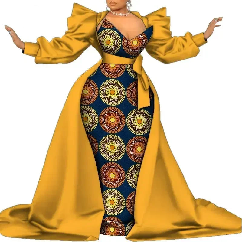 Dress with yellow long sleeves and blue patterned body on a white background