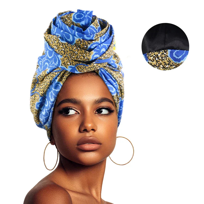 Blue and gold Afrocentric Melody Headwrap with satin lining, providing a luxurious and protective hair accessory. Ideal for everyday wear or special occasions.