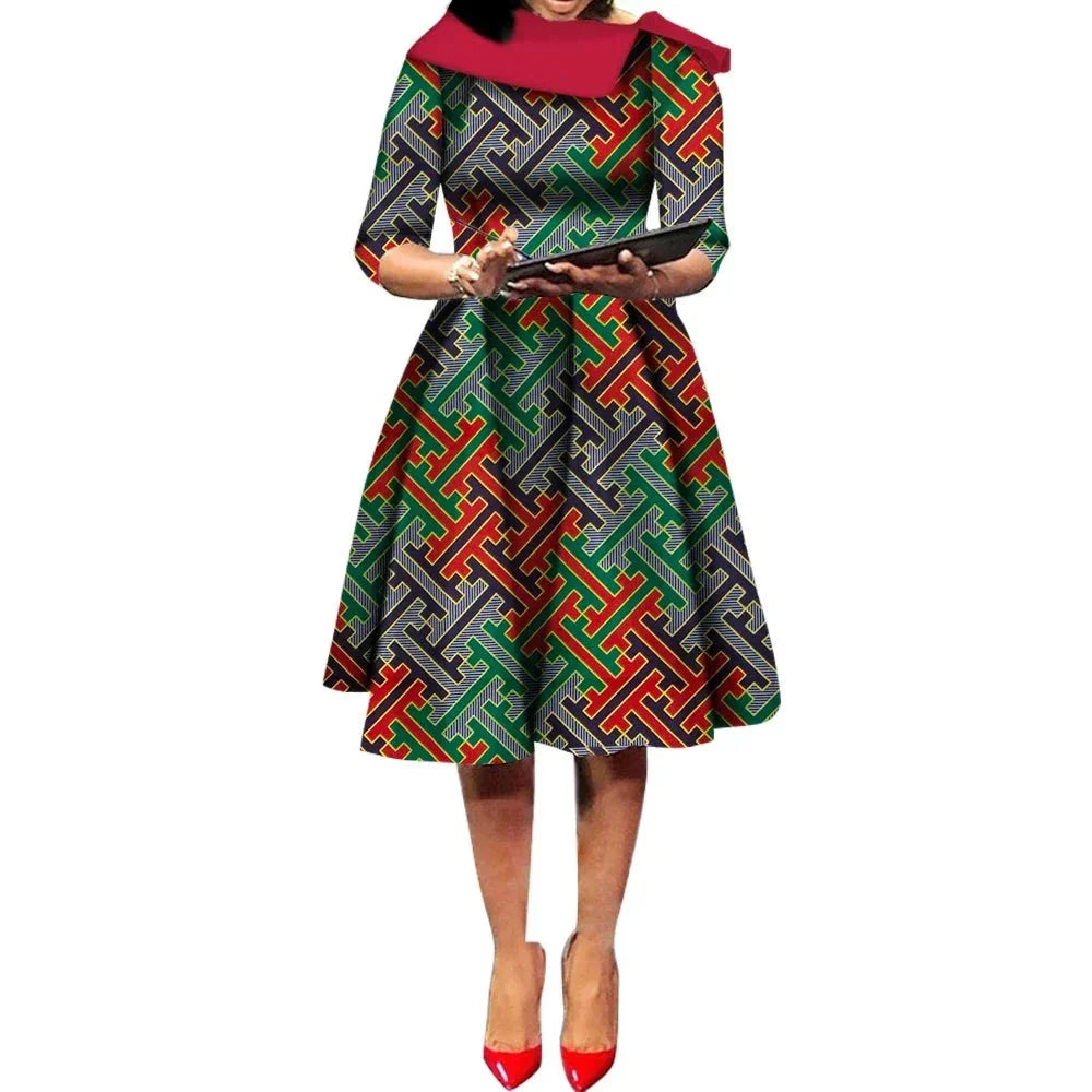 African Ankara Wax Print Midi Dress with a dark base and interlocking red, green, and gray geometric patterns.