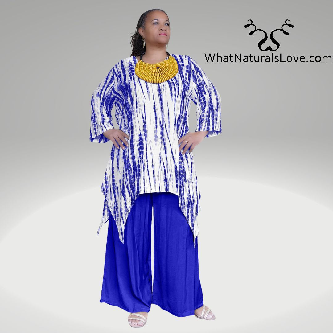 Model wearing a blue Shark Hem Top Pants Set with a tie-dye pattern, accessorized with a bold yellow necklace.