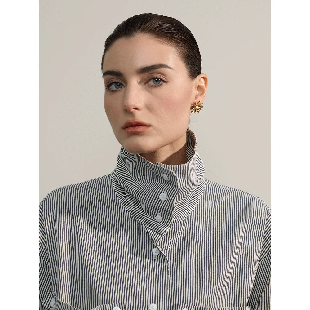 Model wearing gold stainless steel flower stud earrings, showcasing their stylish and elegant design. Perfect accessory for a sophisticated and modern look.