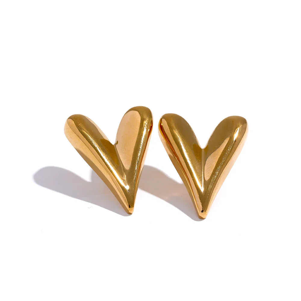 Gold stainless steel heart stud earrings with a polished finish. A fashionable and timeless jewelry piece for women who love elegant accessories.