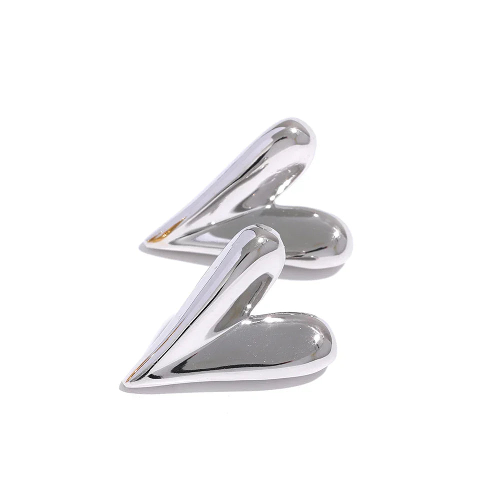 Silver stainless steel heart stud earrings with a sleek and modern design. A stylish and versatile jewelry piece for women’s everyday wear.