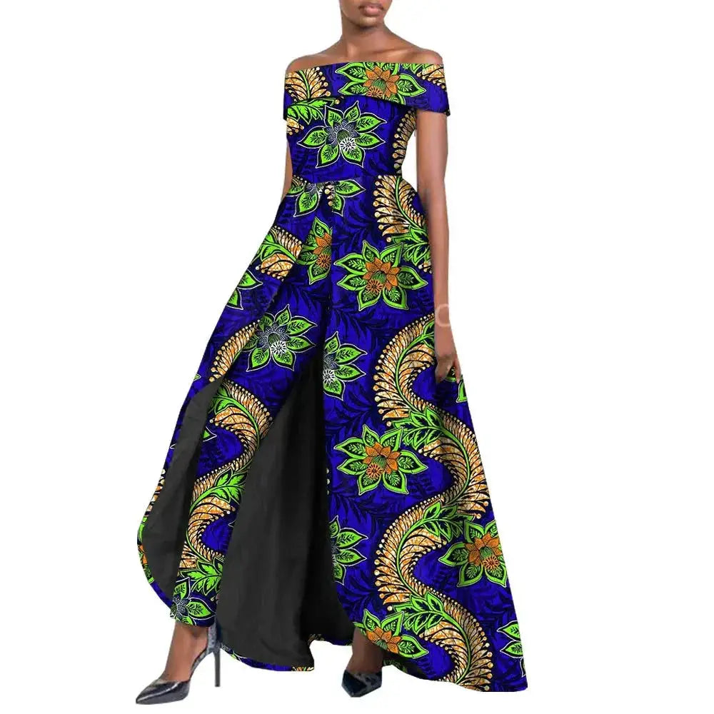 Vibrant African pantsuit for women in blue and green floral print. Off-shoulder design with a long cape, ideal for elegant and powerful fashion looks.