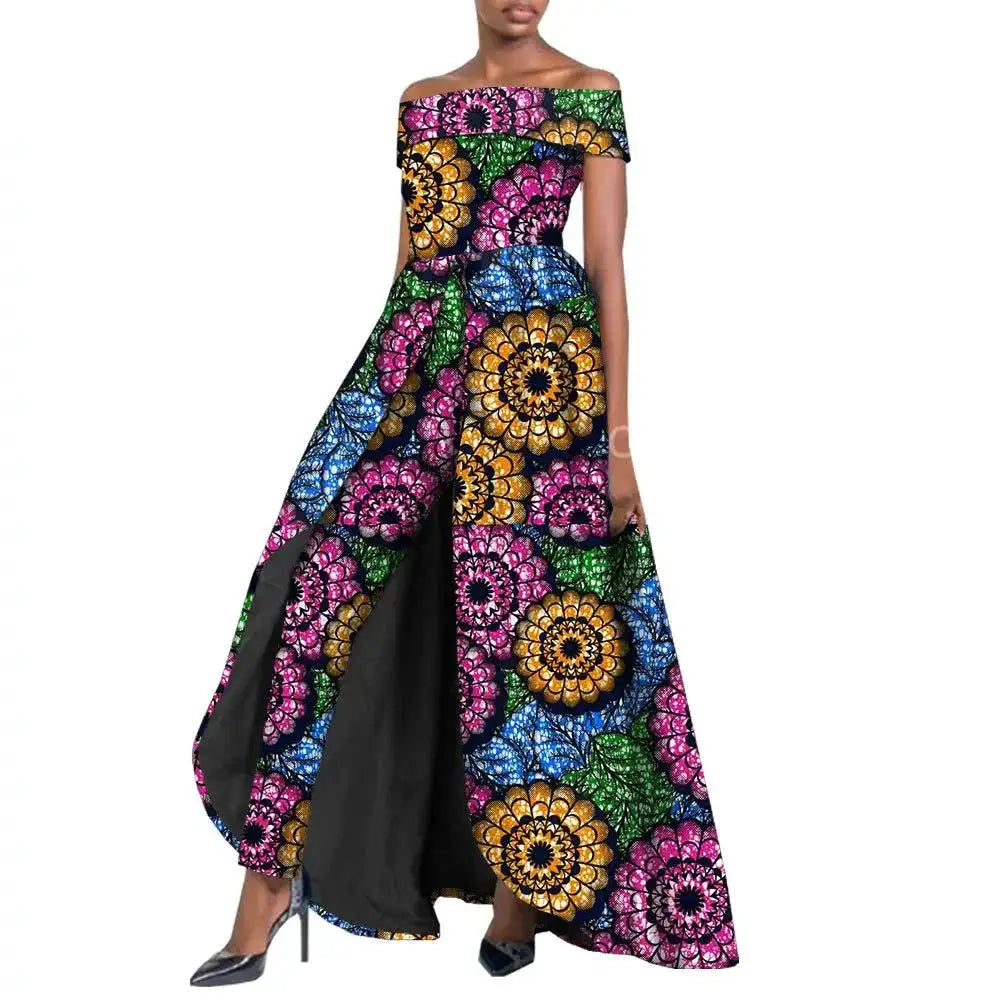Vibrant African pantsuit for women in multicolored floral print. Off-shoulder design with a long cape, ideal for elegant and powerful fashion looks.