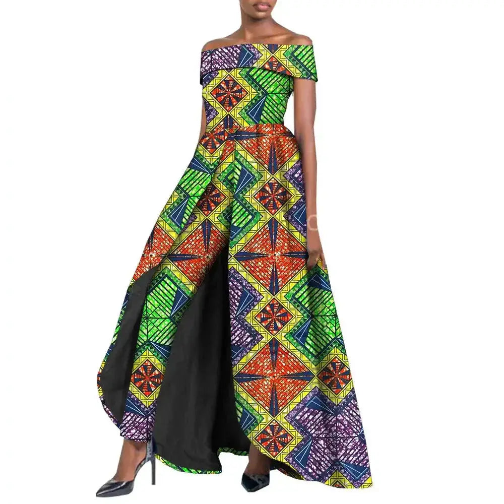 Vibrant African pantsuit for women in multicolored geometric print. Off-shoulder design with a long cape, ideal for elegant and powerful fashion looks.