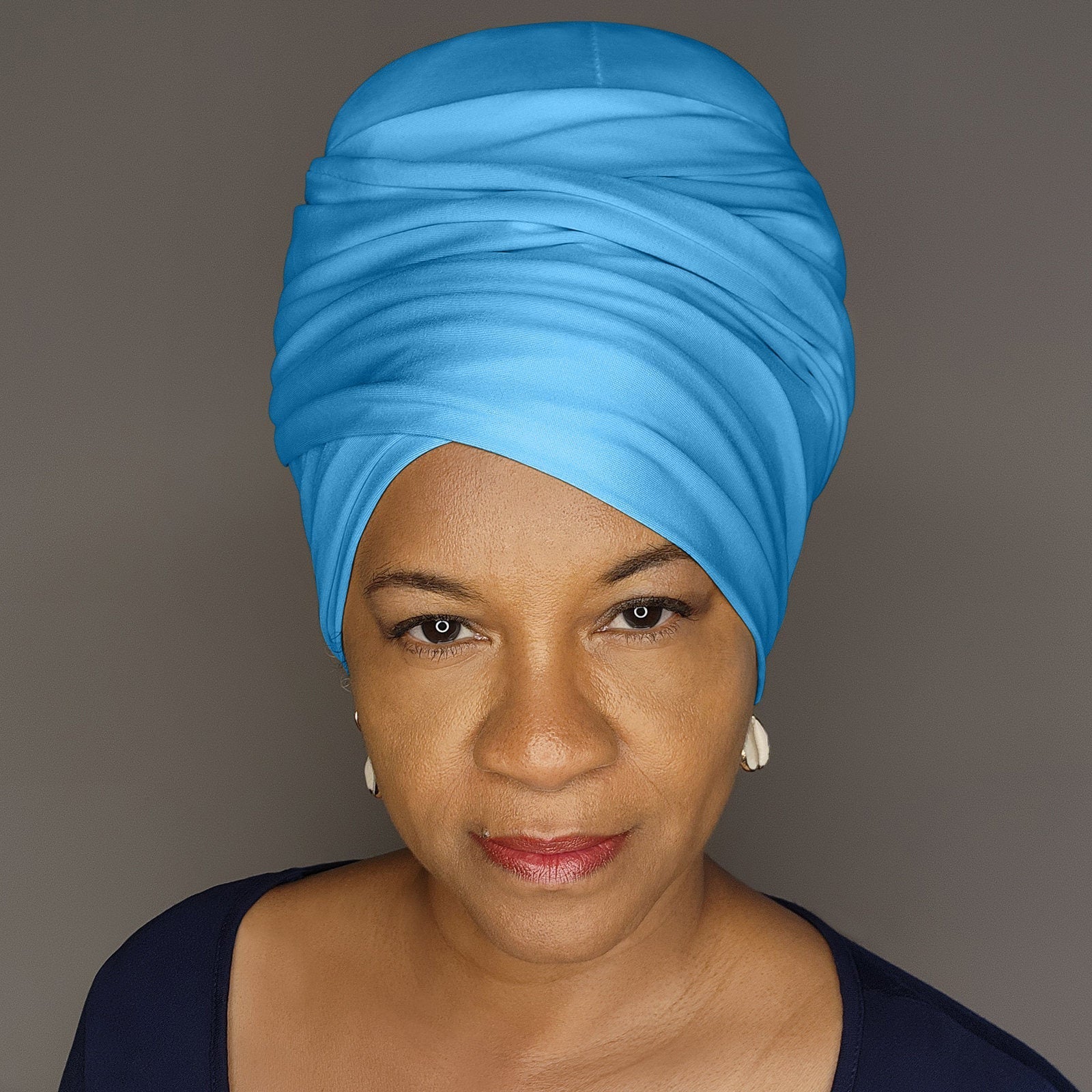 Sky blue tube headwrap for locs, sisterlocks, and dreadlocks. A vibrant and stylish headwear option for natural hair.