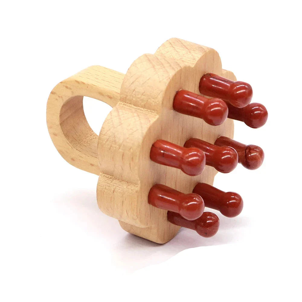 Red jasper crystal scalp massager with a wooden grip. Ideal for stress relief, scalp stimulation, and relaxation.