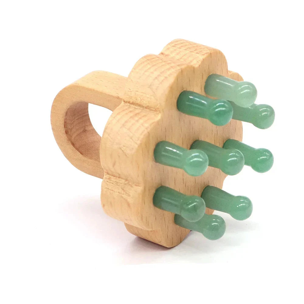 Green aventurine crystal scalp massager with wooden grip. Promotes relaxation, scalp health, and energy balance.