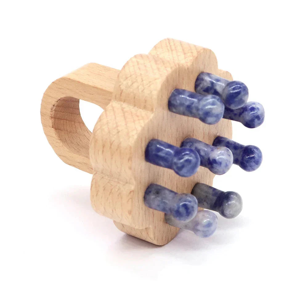 Wooden scalp massager with sodalite crystal tips for soothing scalp stimulation. Ideal for relaxation and hair care.