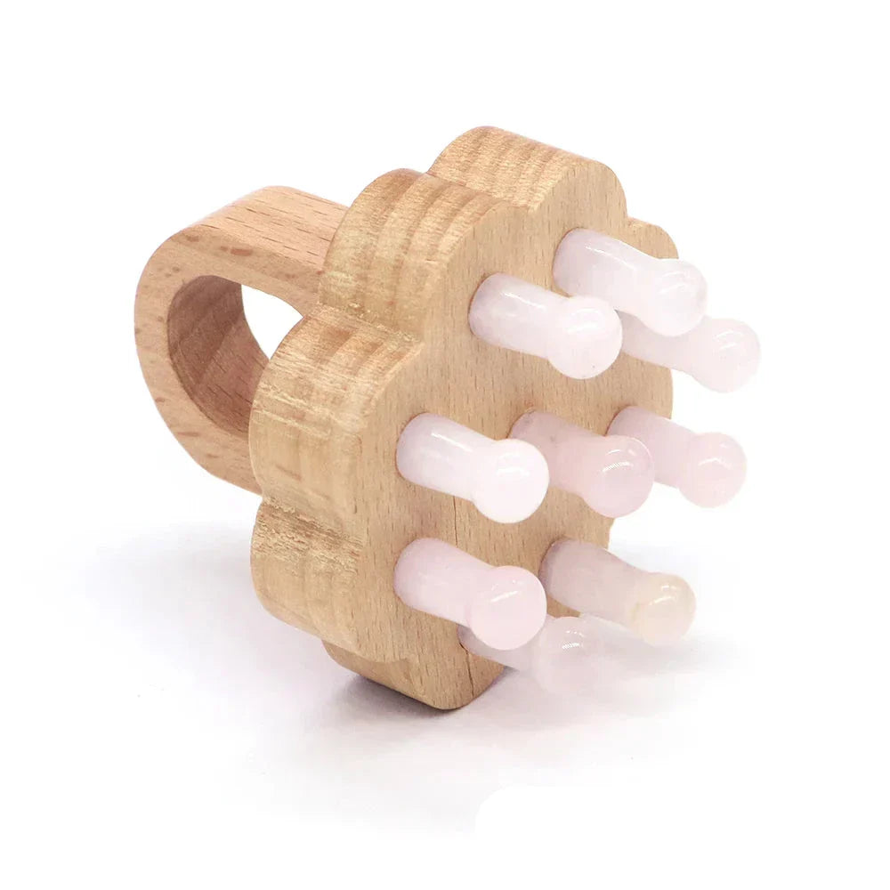 Rose quartz crystal scalp massager with a wooden grip. Encourages relaxation, scalp health, and energy balance.