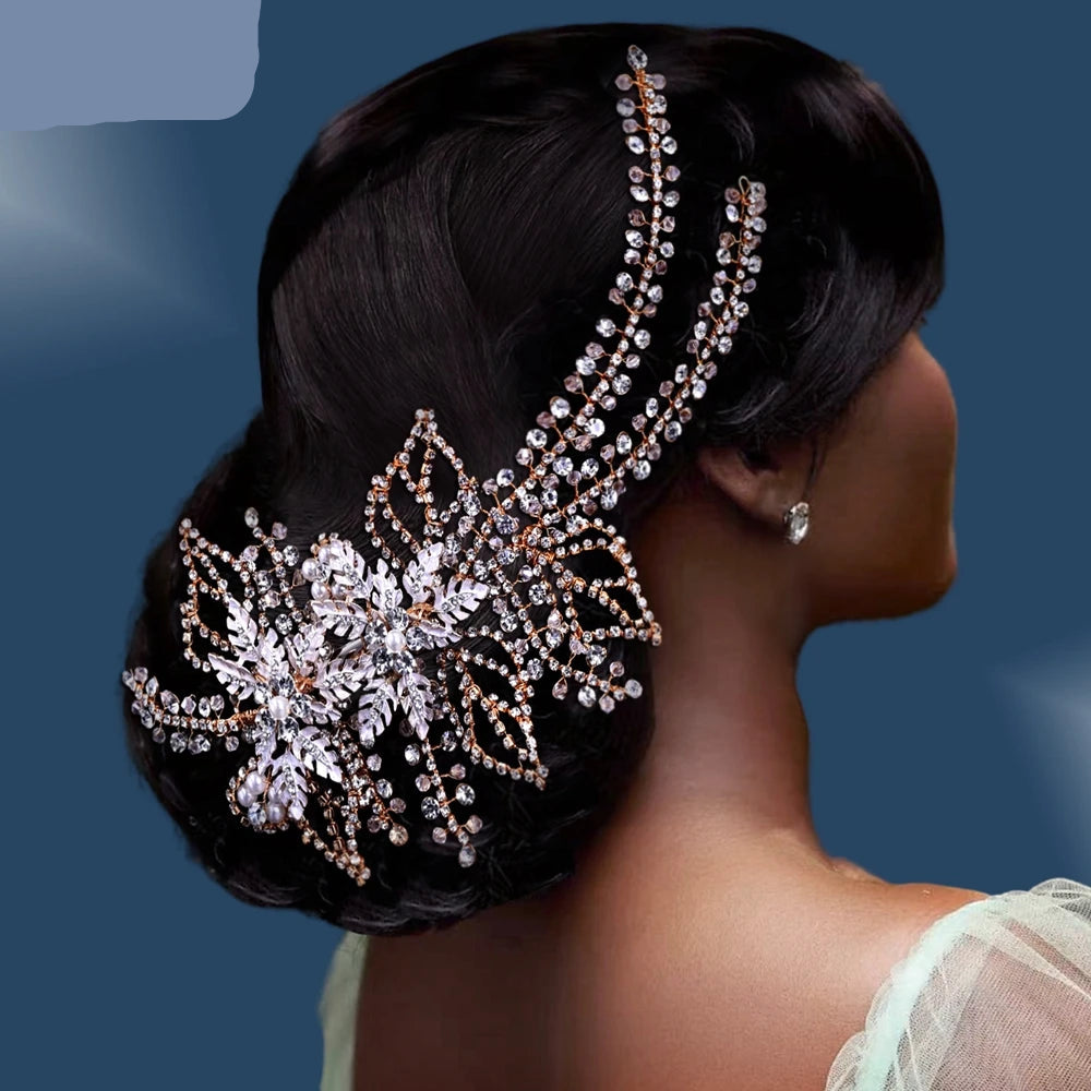 Bride wearing elegant rose gold crystal leaf hairpiece placed on low bun updo