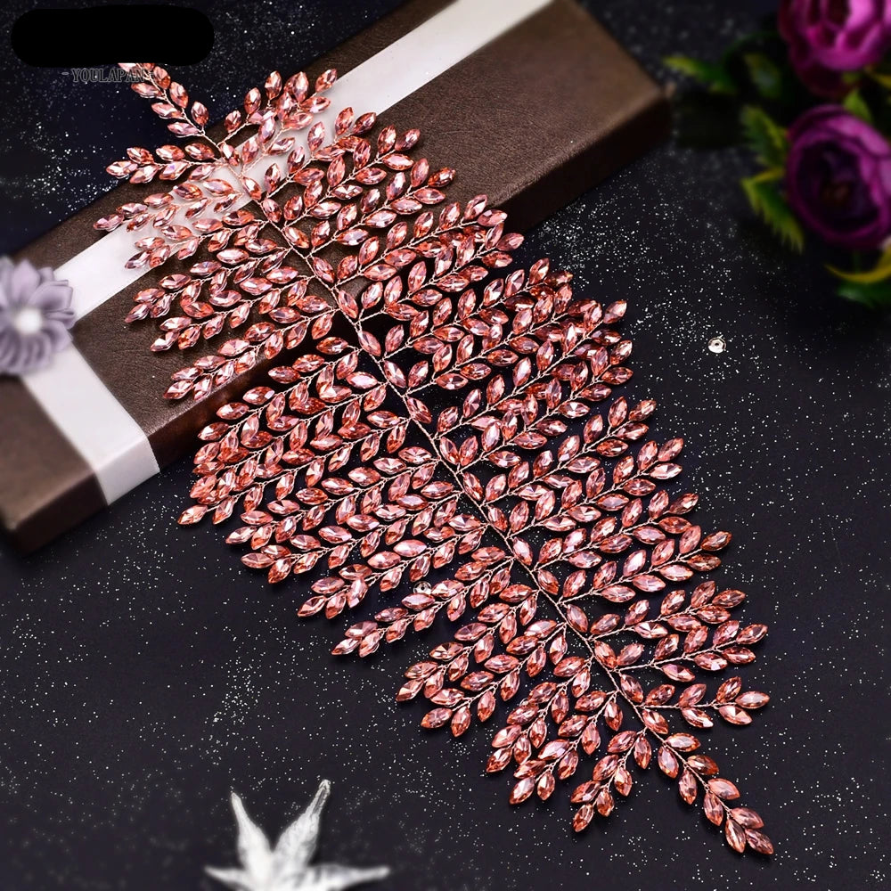 Rose gold leaf bridal tiara with shimmering crystals displayed on gift box