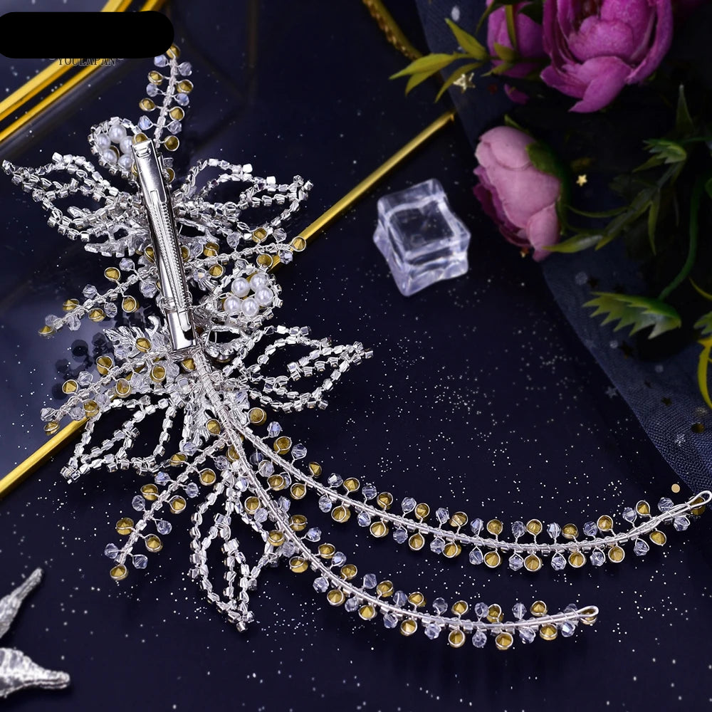 Pair of rose gold double floral bridal hairpieces with crystal leaf design displayed on gift box.