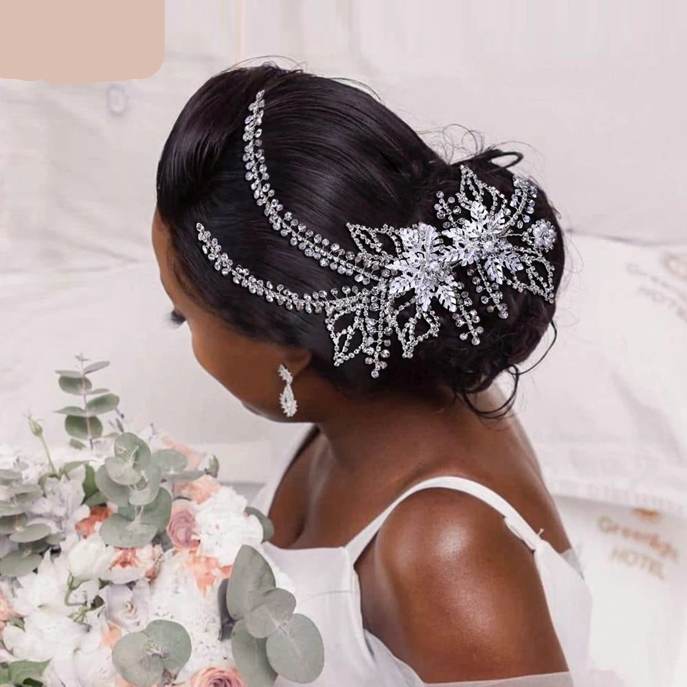 Bride wearing rose gold double floral bridal hairpieces placed symmetrically on a sleek bridal updo