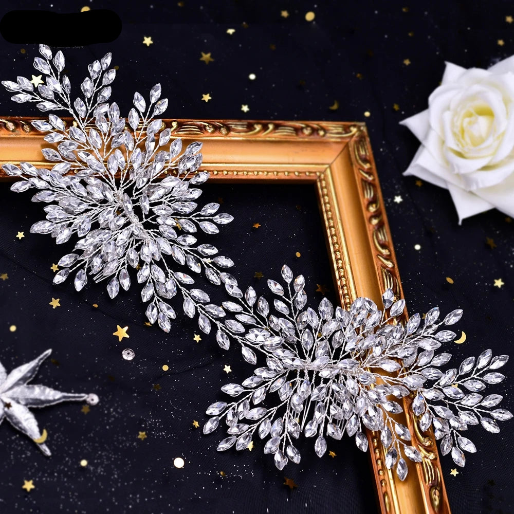 Silver bridal hairpieces with crystal leaf and flower design displayed in gold frame setting