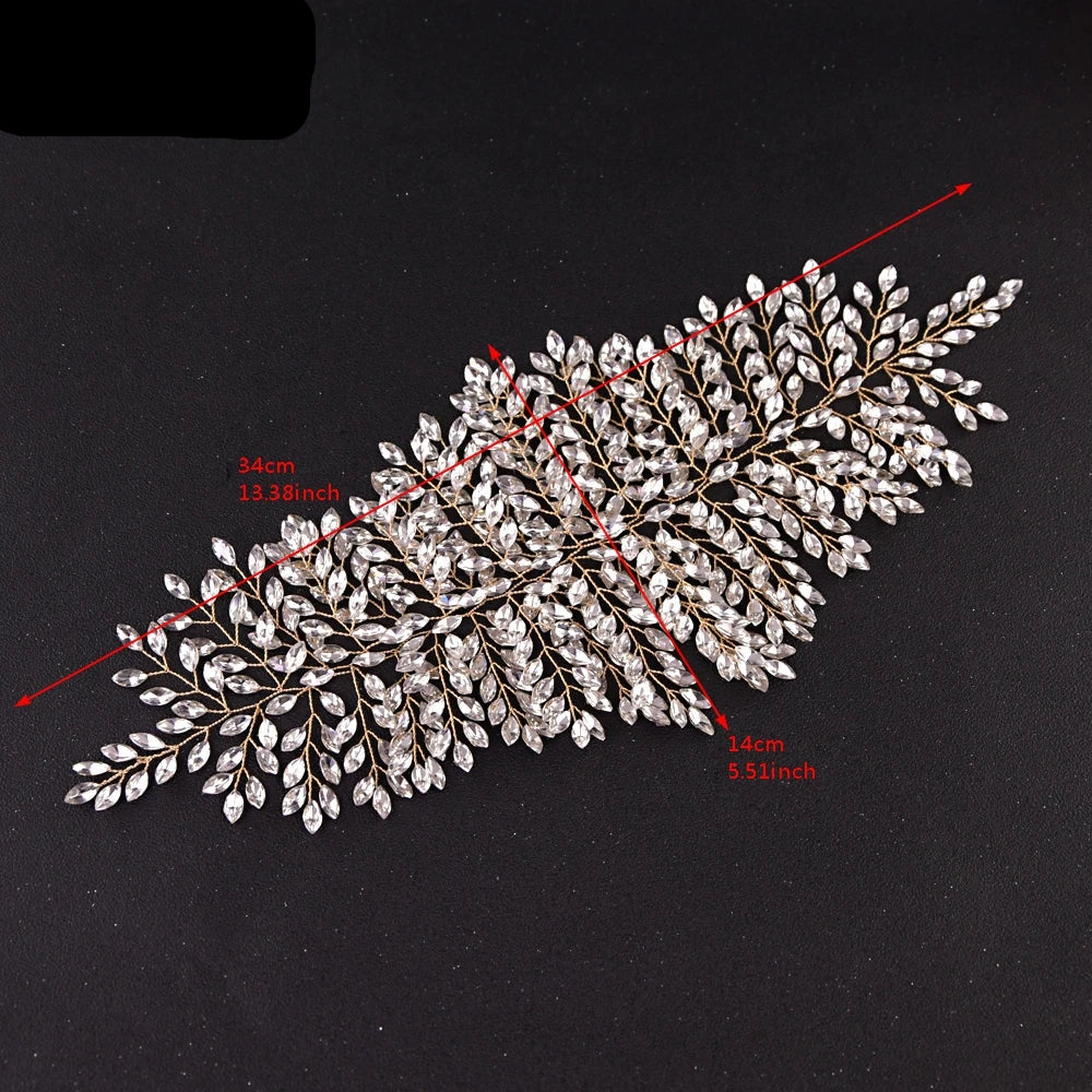 Close-up of silver bridal crown tiara with leaf design showing product dimensions in centimeters and inches