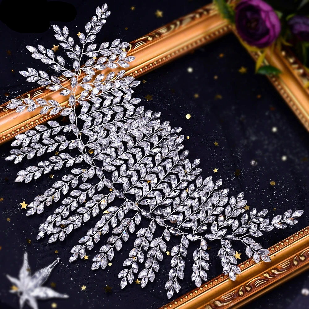 Top angle view of bridal tiara with sparkling crystal leaf details