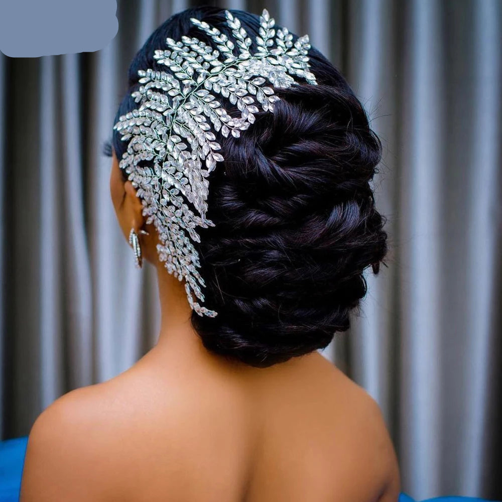 Bride wearing silver bridal crown tiara on elegant side-swept updo