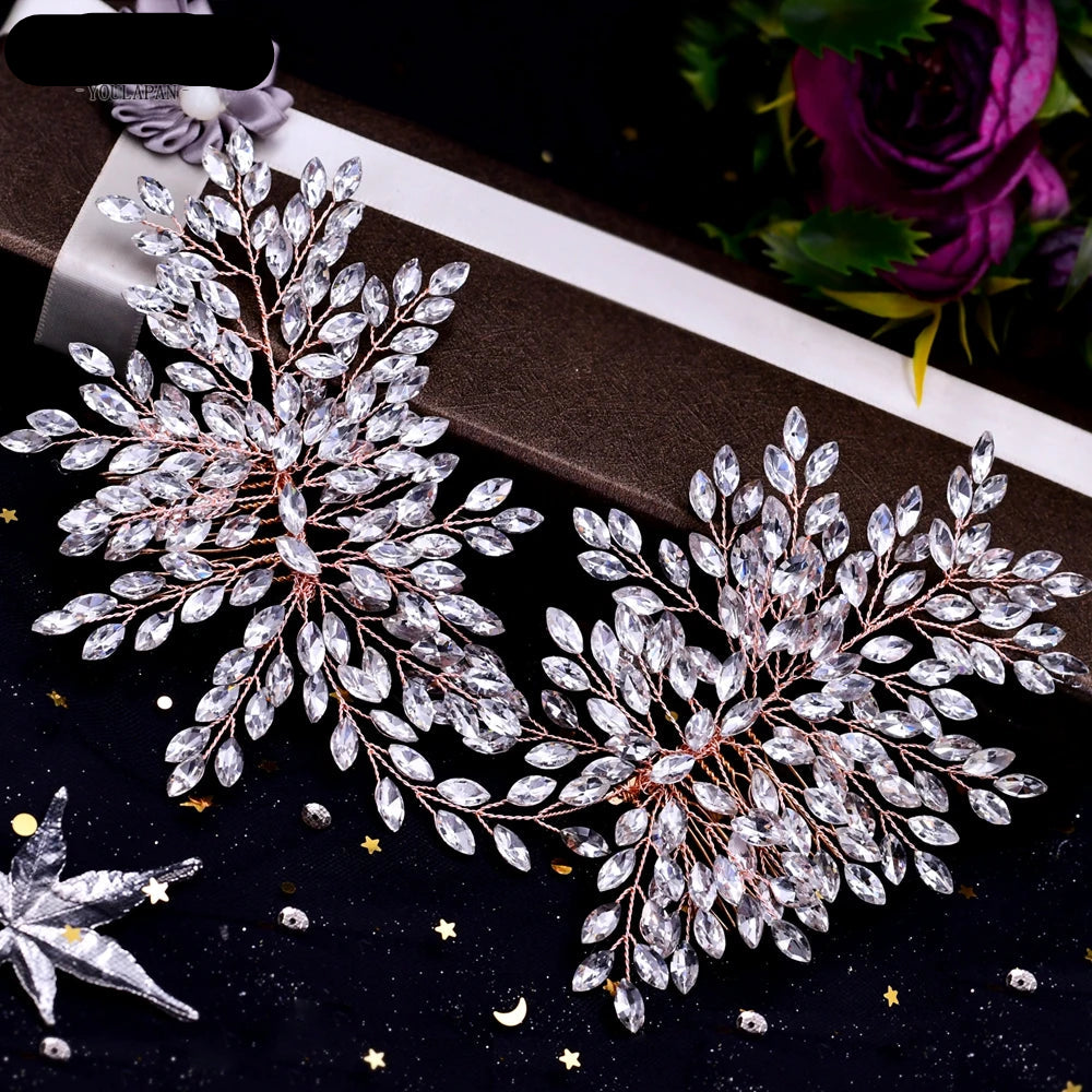 Pair of rose gold bridal hairpieces with double floral crystal design displayed on gift box